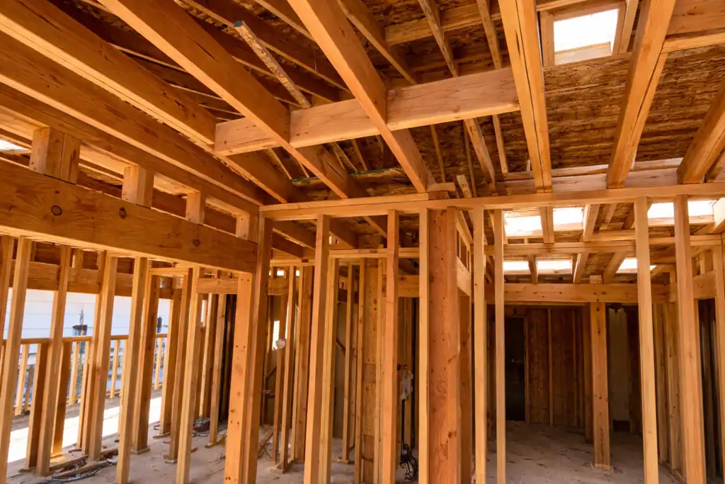 New custom home Framingconstruction in Lafayette showing structural wood framing, engineered beams, roof framing, and interior wall layout during the framing stage.