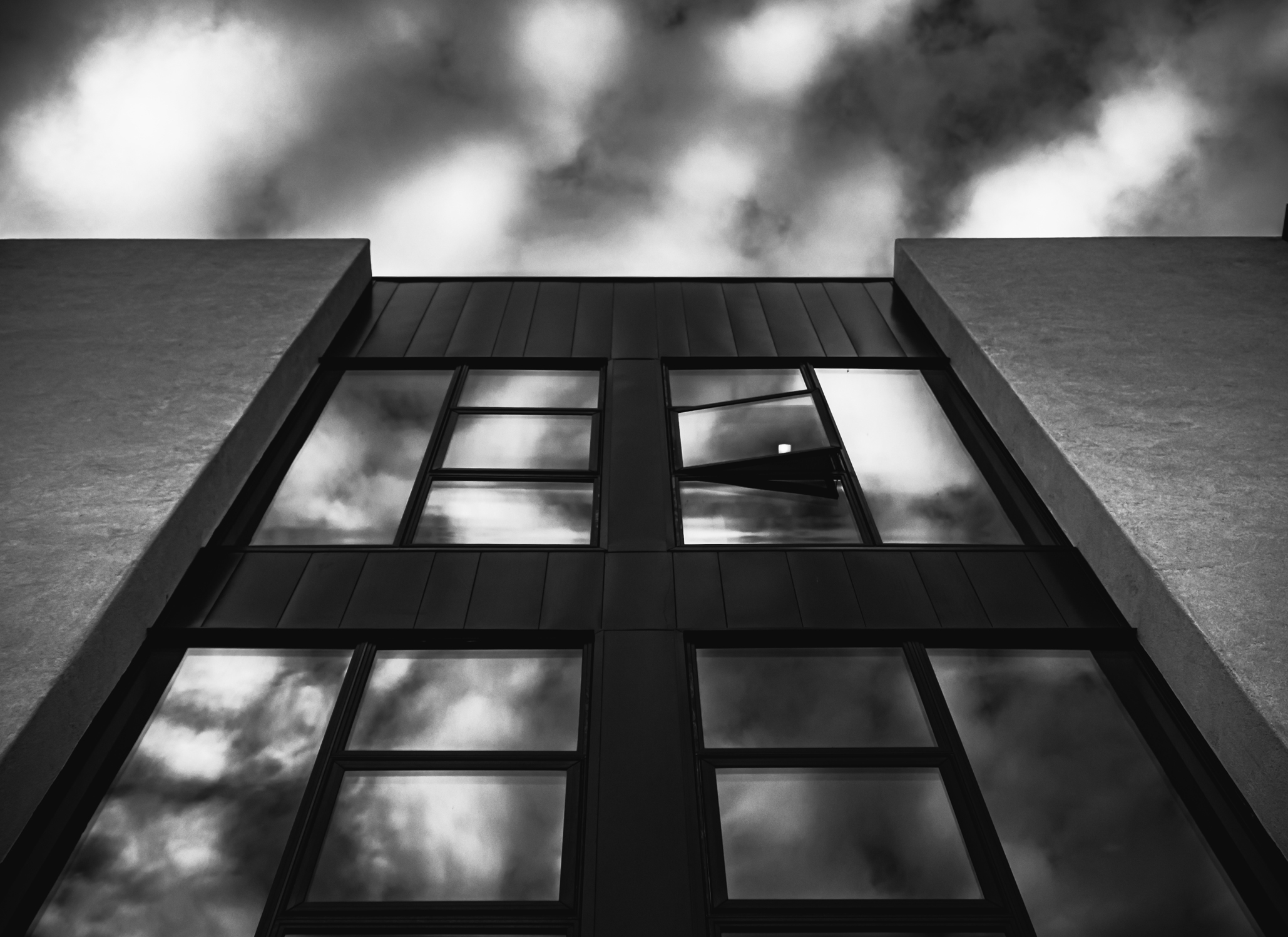 Contemporary architectural facade with dark sculptural lines, design-build craftsmanship and remodeling inspiration