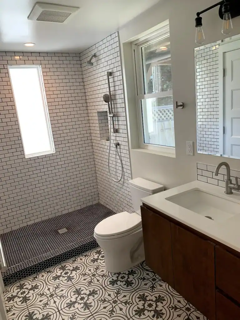 A full bathroom inside a converted garage in-law suite - plumbing done right, permitted and inspected