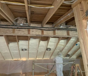 Ceiling insulation and electrical work. Ceiling insulation and recessed lighting rough-in during a home renovation.
