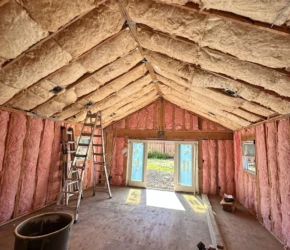 Insulated vaulted ceiling framing. Insulated vaulted ceiling and wall framing in a residential home addition.