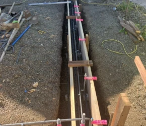 Reinforced foundation formwork. Rebar and wood foundation forms prepared for a residential home in Lafayette.
