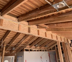 Structural beam and electrical rough-in. Structural beams, ceiling framing, and electrical rough-in during a home remodel. Lafayette, CA.
