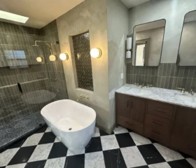 A custom-designed bathroom that combines timeless materials, functionality, and everyday comfort. Luxury bathroom remodel in Oakland, with freestanding tub, walk-in shower, double vanity, and custom tile.