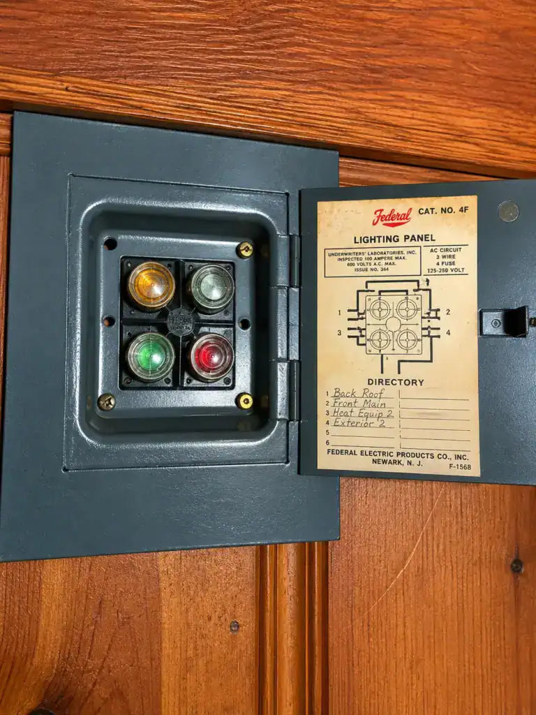 Original four-circuit 30 amp fuse panel in an existing home, opened during a major renovation electrical survey