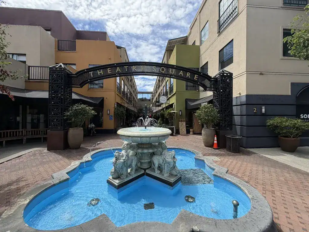 Fountain and arched entry sign at Theatre Square in downtown Orinda, California